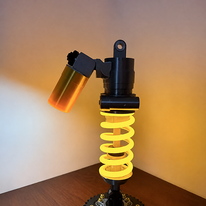 🔥Inspired Suspension Shock Absorber Lamp - Adjustable LED Light for Gamers & Car Enthusiasts